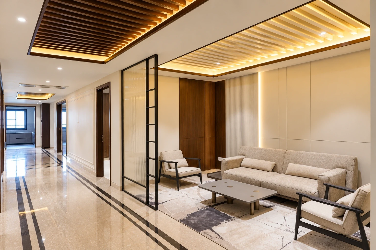 Palam View lounge beside the marble hallway, with a cream sofa, armchairs and a glass partition